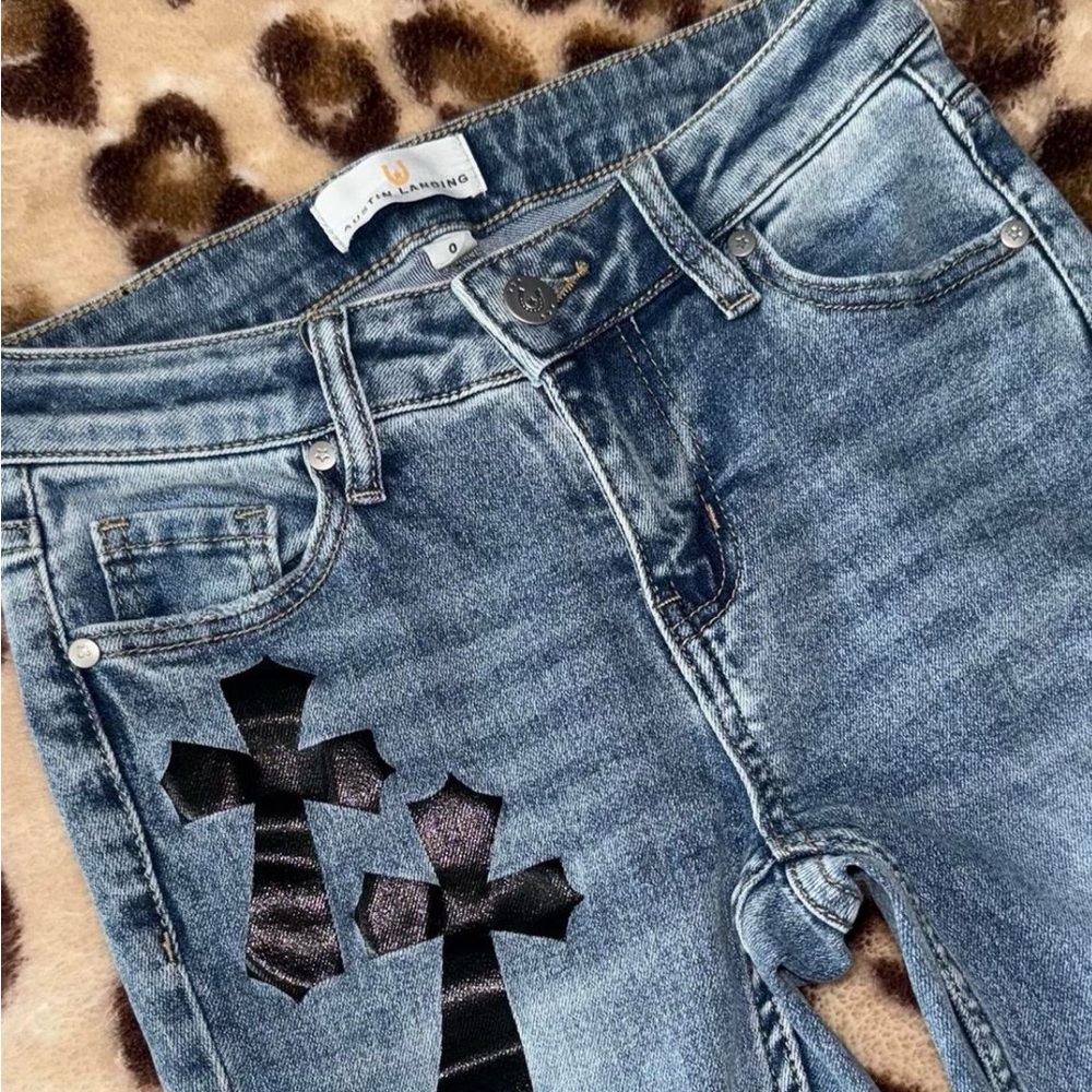 Stylish Austen Landing Blue Jeans with Black Cross Accents